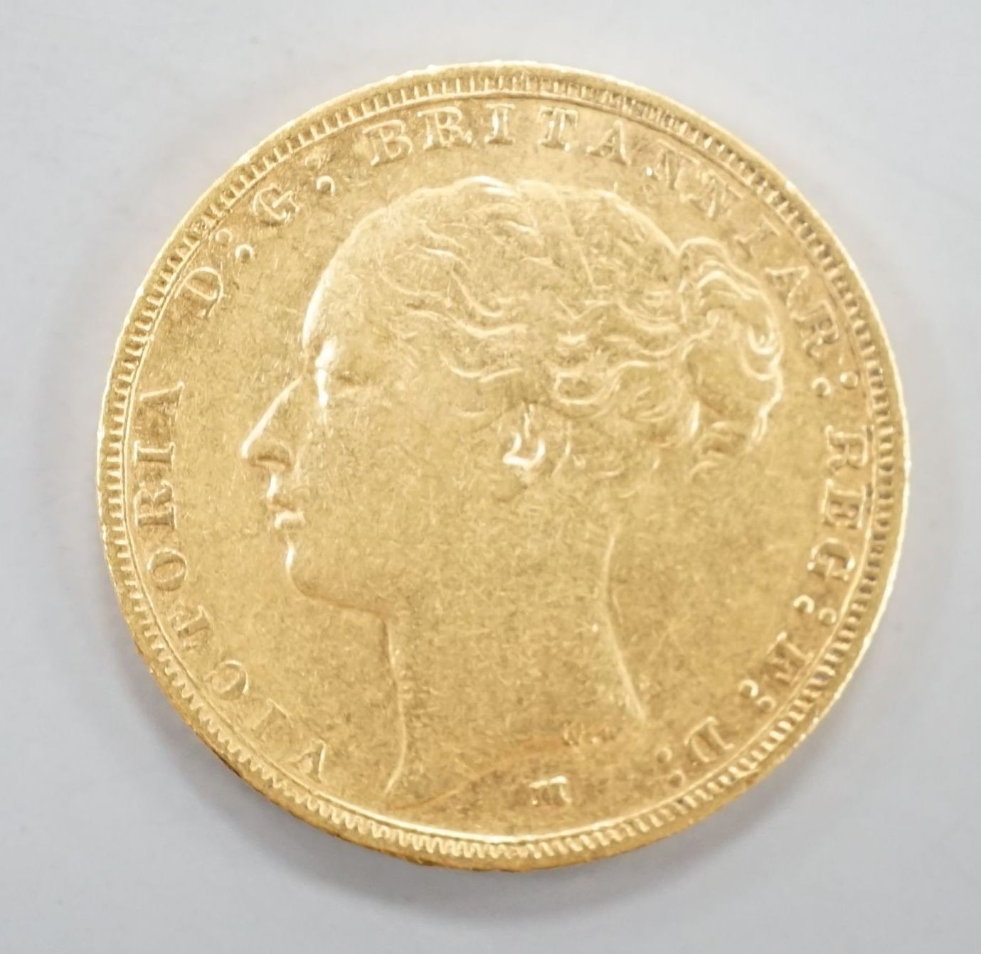A Victoria 1883 gold sovereign.